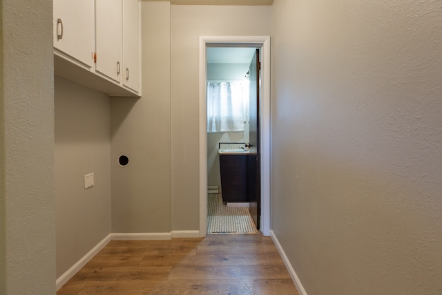 laundry area featuring light hardwood / wood-style flooring