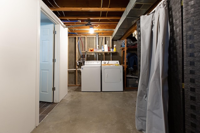 basement with washing machine and clothes dryer