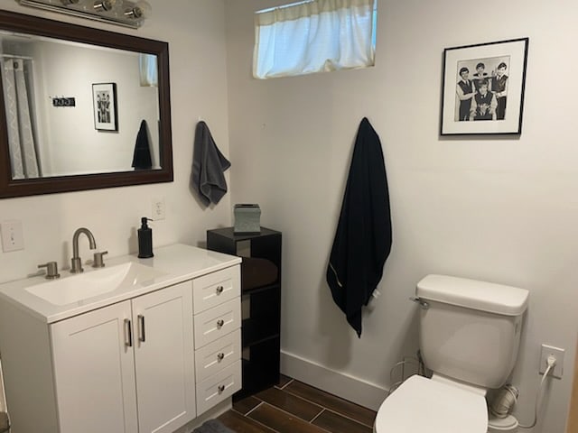 bathroom featuring vanity and toilet