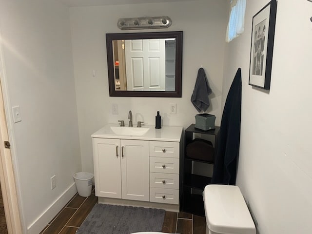 bathroom with vanity and toilet