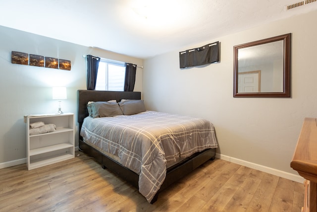 bedroom featuring light hardwood / wood-style floors