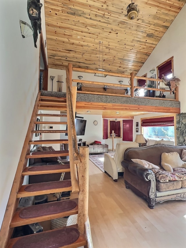 interior space featuring hardwood / wood-style floors, wood ceiling, and vaulted ceiling