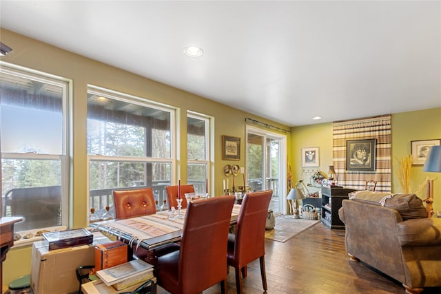 dining room with light hardwood / wood-style flooring and a wealth of natural light