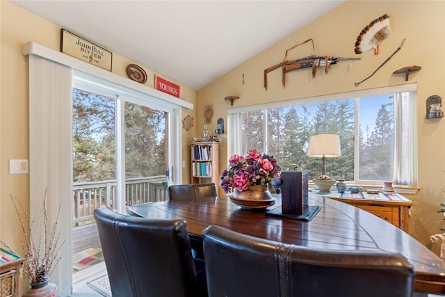 dining space with vaulted ceiling