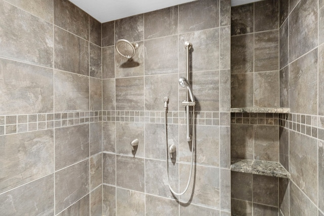 bathroom with tiled shower