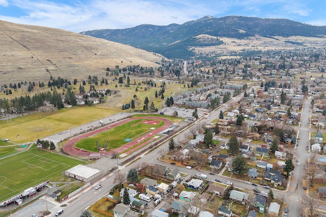 birds eye view of property featuring a mountain view