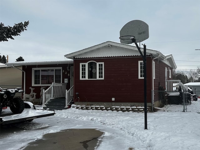 view of snow covered house