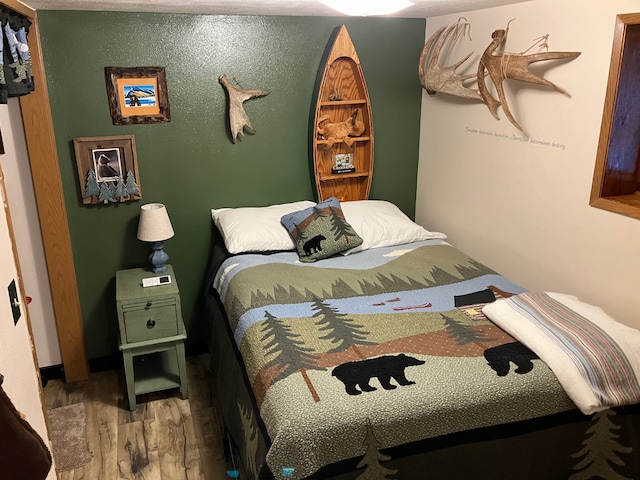 bedroom featuring wood-type flooring