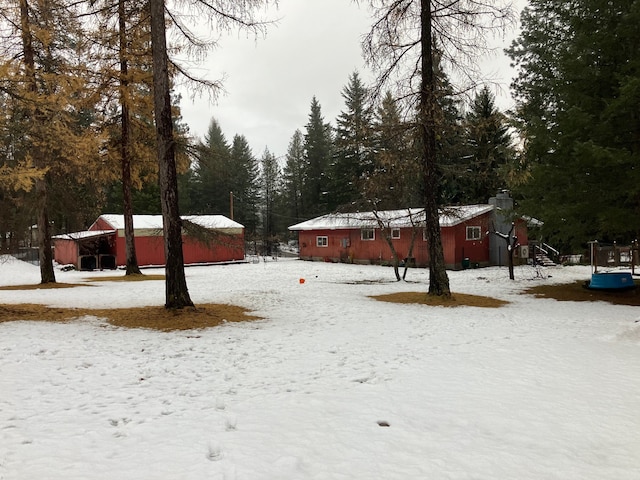 view of yard covered in snow