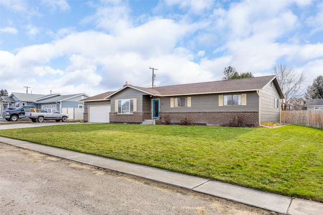 single story home with a front yard and a garage