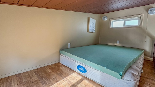 interior space featuring wood ceiling and hardwood / wood-style flooring