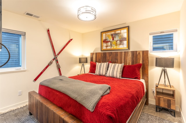 bedroom with dark colored carpet