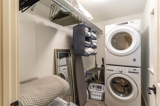 laundry room with stacked washer / drying machine