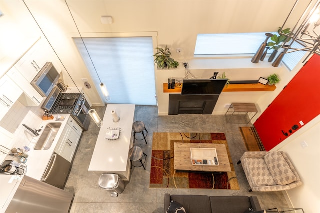 interior space with white cabinets and sink