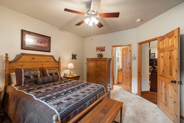 carpeted bedroom with a closet and ceiling fan