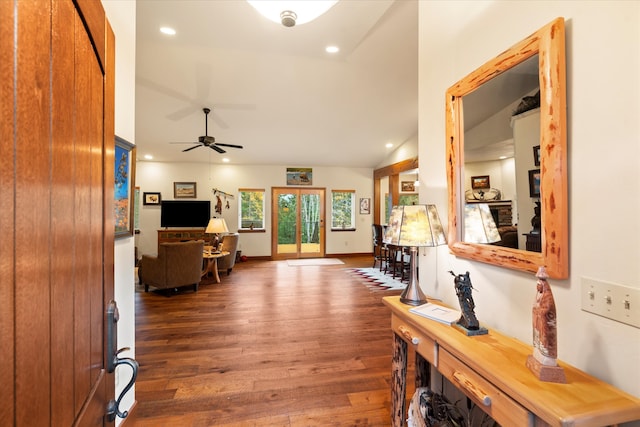 entrance foyer with dark hardwood / wood-style floors, ceiling fan, and lofted ceiling