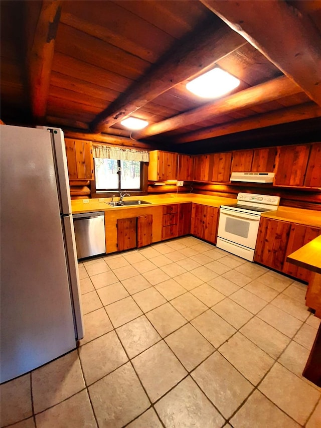 kitchen featuring appliances with stainless steel finishes, wood ceiling, sink, light tile patterned floors, and beamed ceiling