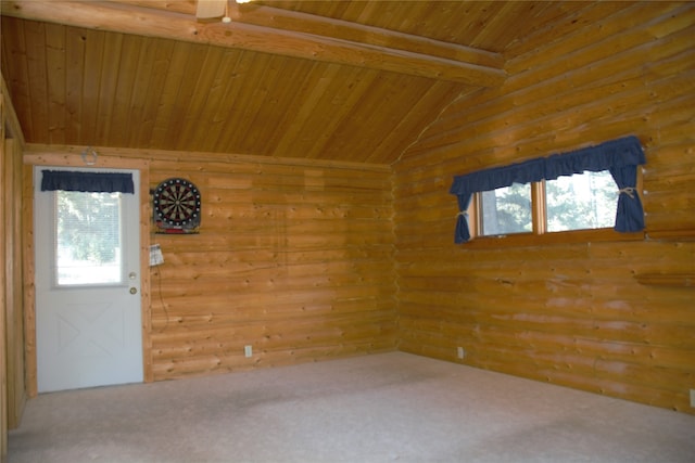 empty room with lofted ceiling with beams, carpet floors, and wooden ceiling