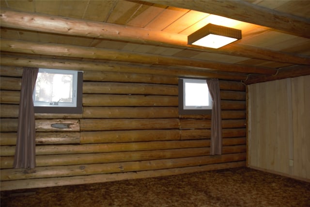 basement with plenty of natural light and wooden ceiling