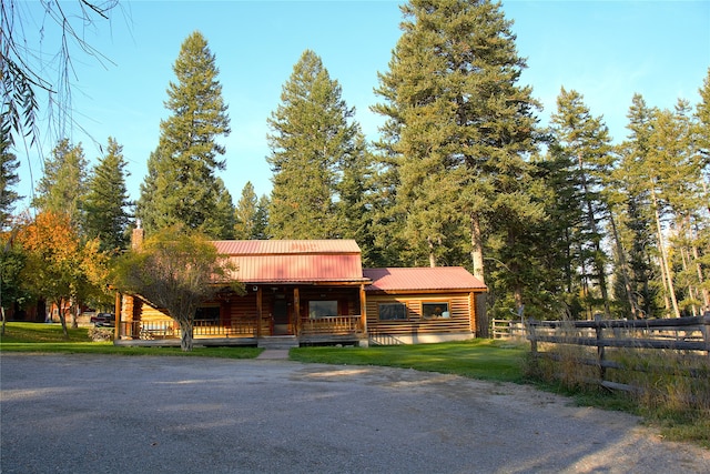 log home with covered porch