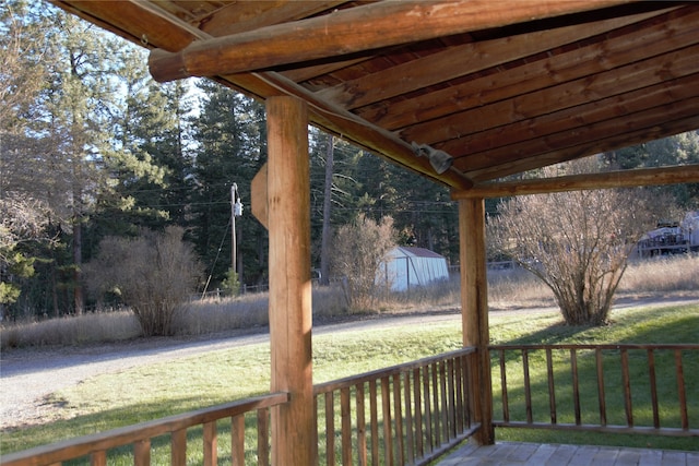 wooden terrace with a yard