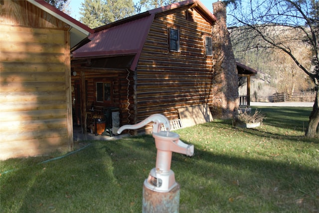 view of home's exterior with a yard