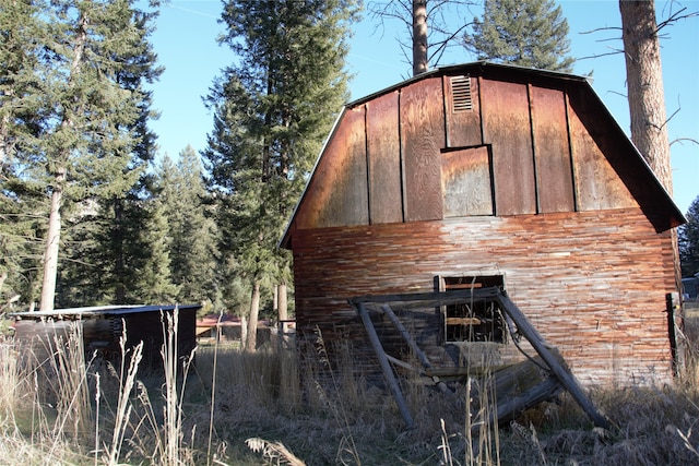 view of side of home with an outbuilding