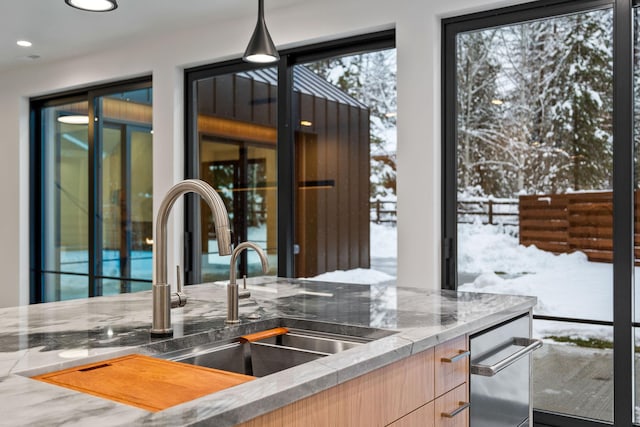 1027 State Park Rd, Whitefish, MT 59937 - kitchen with modern cabinets, light brown cabinets, stone counters, and recessed lighting