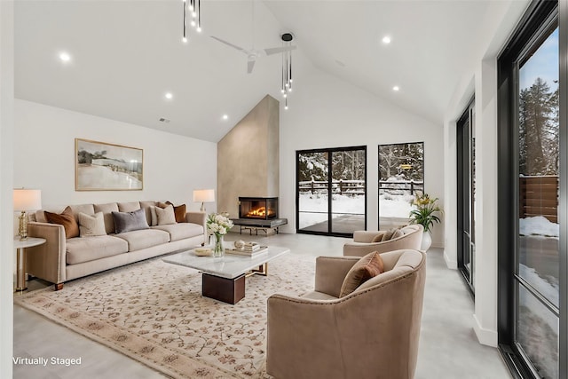 1027 State Park Rd, Whitefish, MT 59937 - living area with high vaulted ceiling, a large fireplace, and recessed lighting