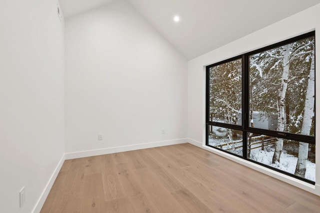 1027 State Park Rd, Whitefish, MT 59937 - spare room featuring light wood-type flooring, healthy amount of natural light, high vaulted ceiling, and recessed lighting