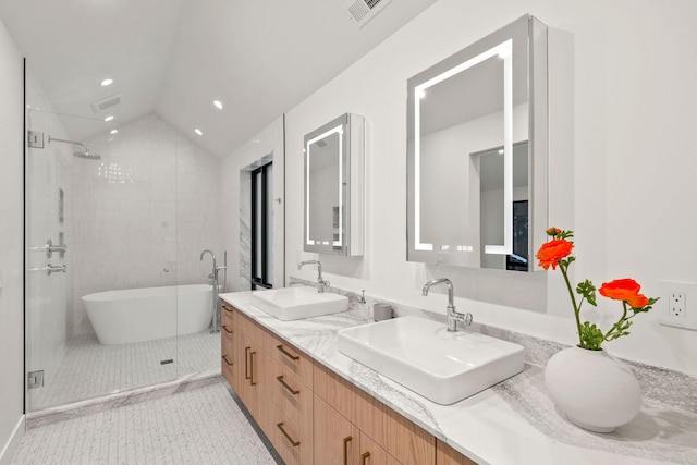 bathroom featuring tile patterned flooring, shower with separate bathtub, vanity, and lofted ceiling