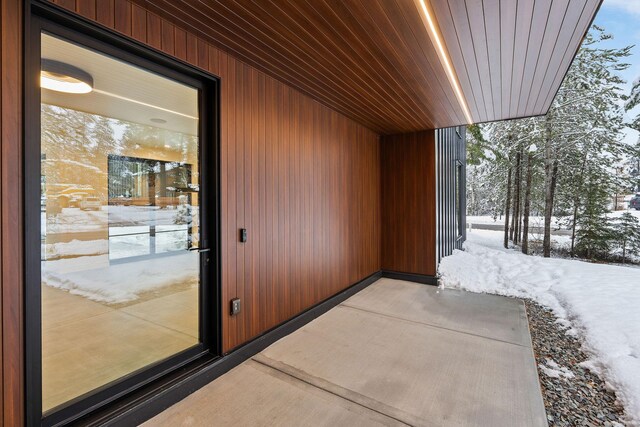 view of snow covered property entrance