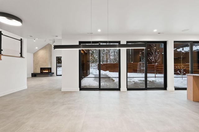 1027 State Park Rd, Whitefish, MT 59937 - unfurnished room featuring concrete flooring, recessed lighting, and a fireplace