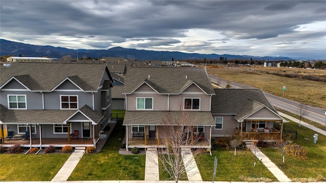 1825 Scott St Unit B, Missoula, MT 59802 - view of front facade featuring covered porch, a mountain view, and roof with shingles