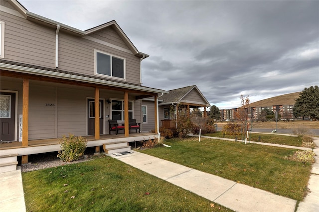 1825 Scott St Unit B, Missoula, MT 59802 - view of front of property with covered porch and a front lawn
