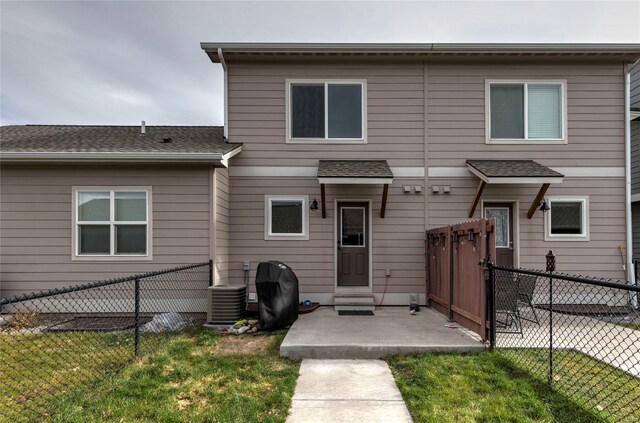 1825 Scott St Unit B, Missoula, MT 59802 - back of property with central AC and a shingled roof