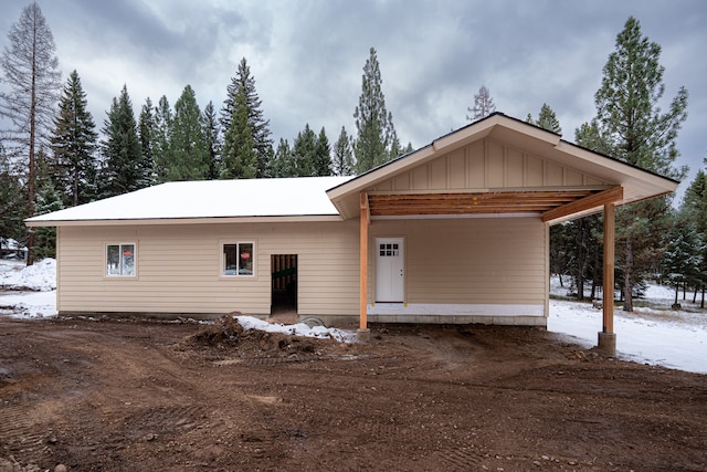 view of front of home featuring a carport