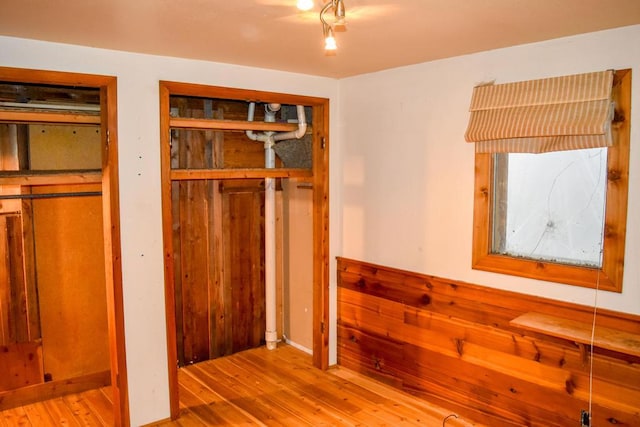 32927 Hellroaring Rd, Polson, MT 59860 - interior space with wooden walls and hardwood / wood-style floors