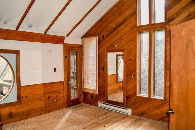 32927 Hellroaring Rd, Polson, MT 59860 - entrance foyer featuring baseboard heating, wooden walls, vaulted ceiling, and wood-type flooring