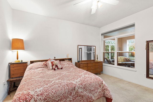 bedroom featuring light carpet and ceiling fan