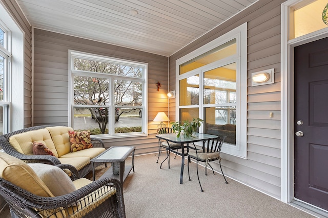 sunroom featuring wooden ceiling