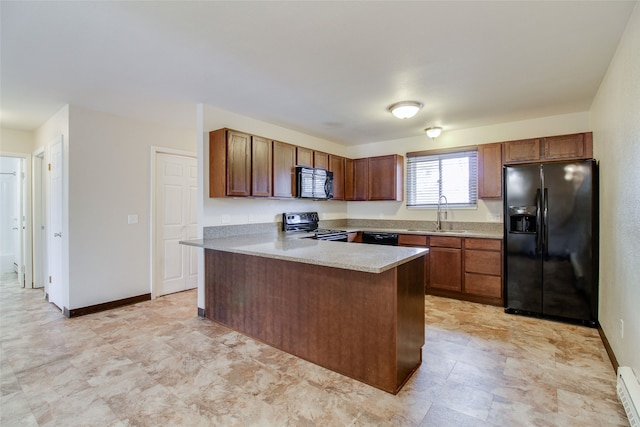 kitchen with kitchen peninsula, sink, baseboard heating, and black appliances