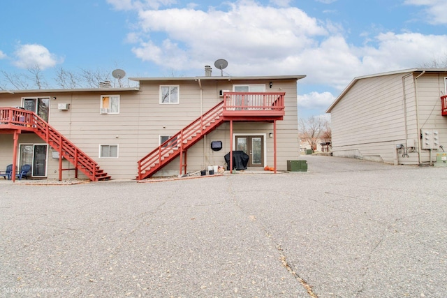 back of house featuring a deck