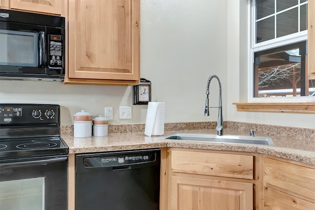 kitchen featuring black appliances, light brown cabinets, and sink