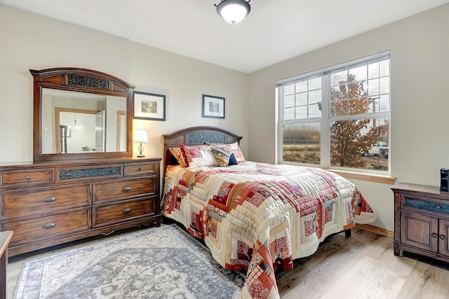 bedroom with light hardwood / wood-style floors