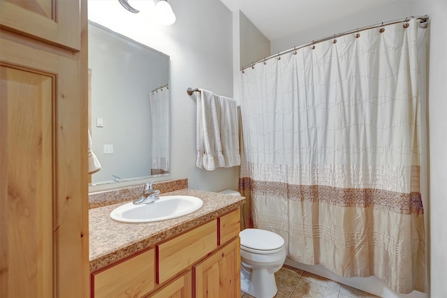 bathroom with tile patterned floors, vanity, a shower with shower curtain, and toilet