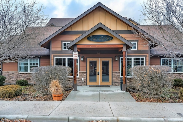 craftsman-style house featuring french doors