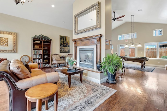 living room with wood-type flooring, high vaulted ceiling, ceiling fan, and billiards