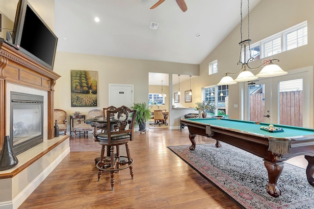 rec room with light wood-type flooring, high vaulted ceiling, plenty of natural light, and pool table