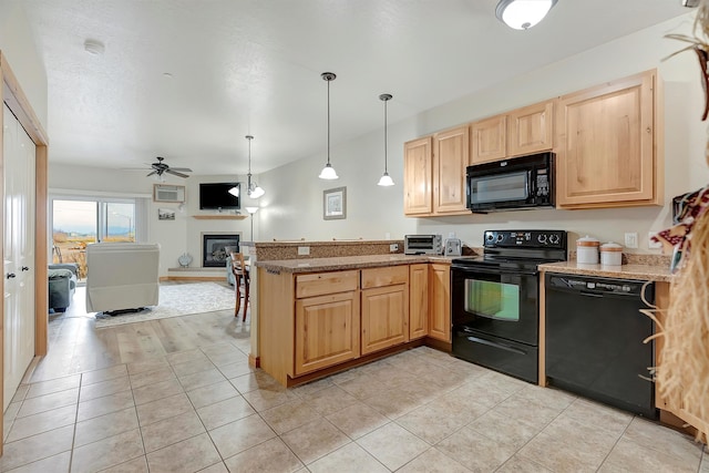 kitchen featuring black appliances, hanging light fixtures, ceiling fan, light wood-type flooring, and kitchen peninsula